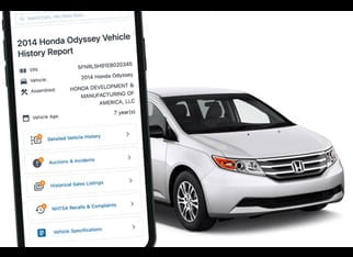 Vehicle history report next to a car